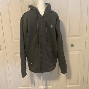 Never worn Men’s U.S.Polo Assn. sherpa lined zip of sweatshirt  size Medium.